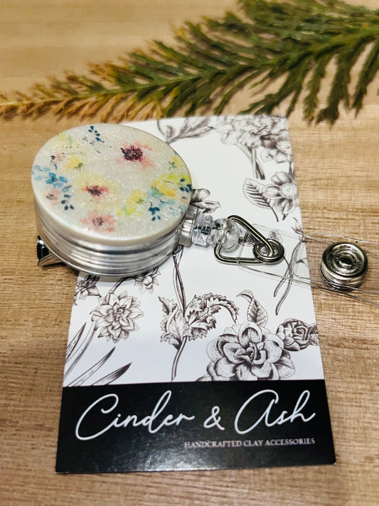 SHIMMER FLORAL BADGE REEL